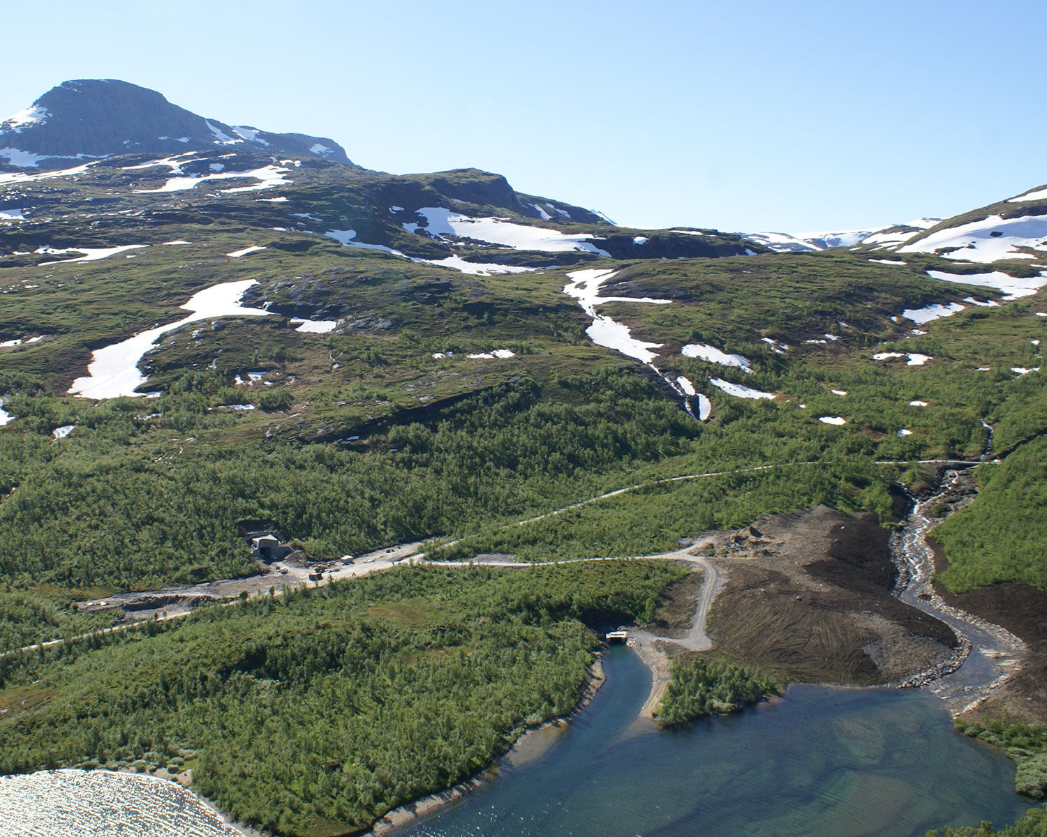 Excavation, access tunnel and reception building at Kjensvatn power plant